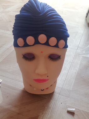 Blue Head Covering with Peach Accents